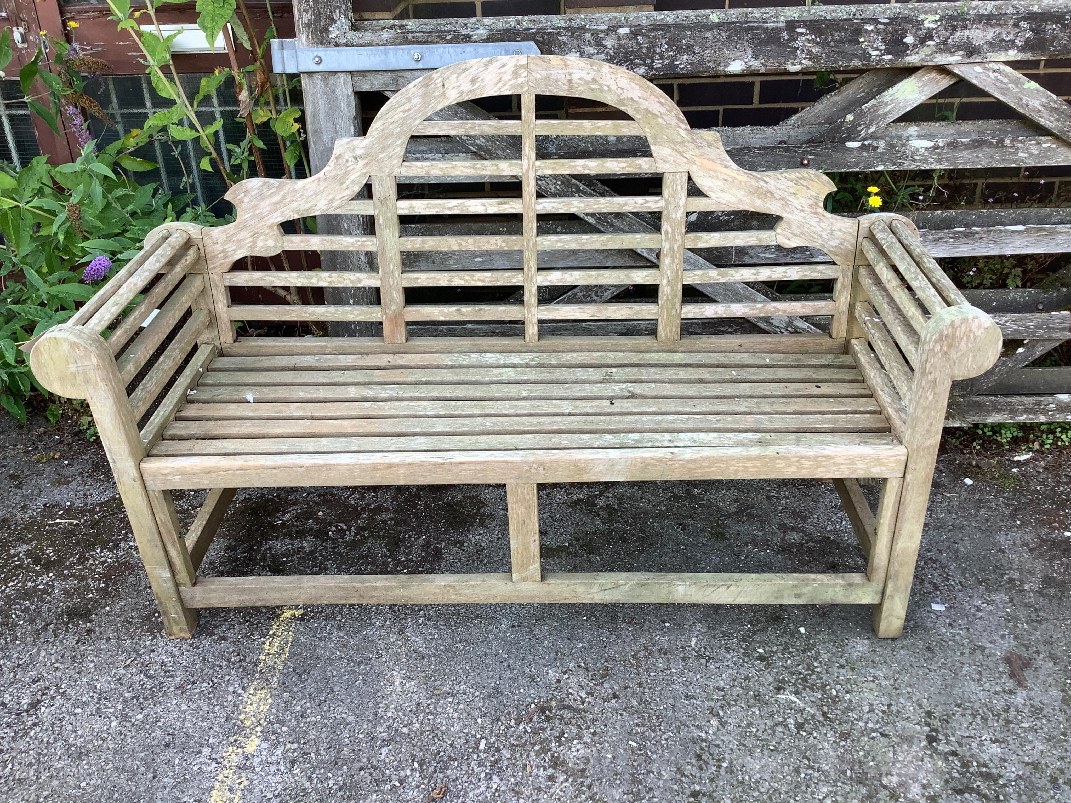 A Lutyens style weathered teak garden bench, width 165cm, depth 50cm, height 105cm. Condition - good